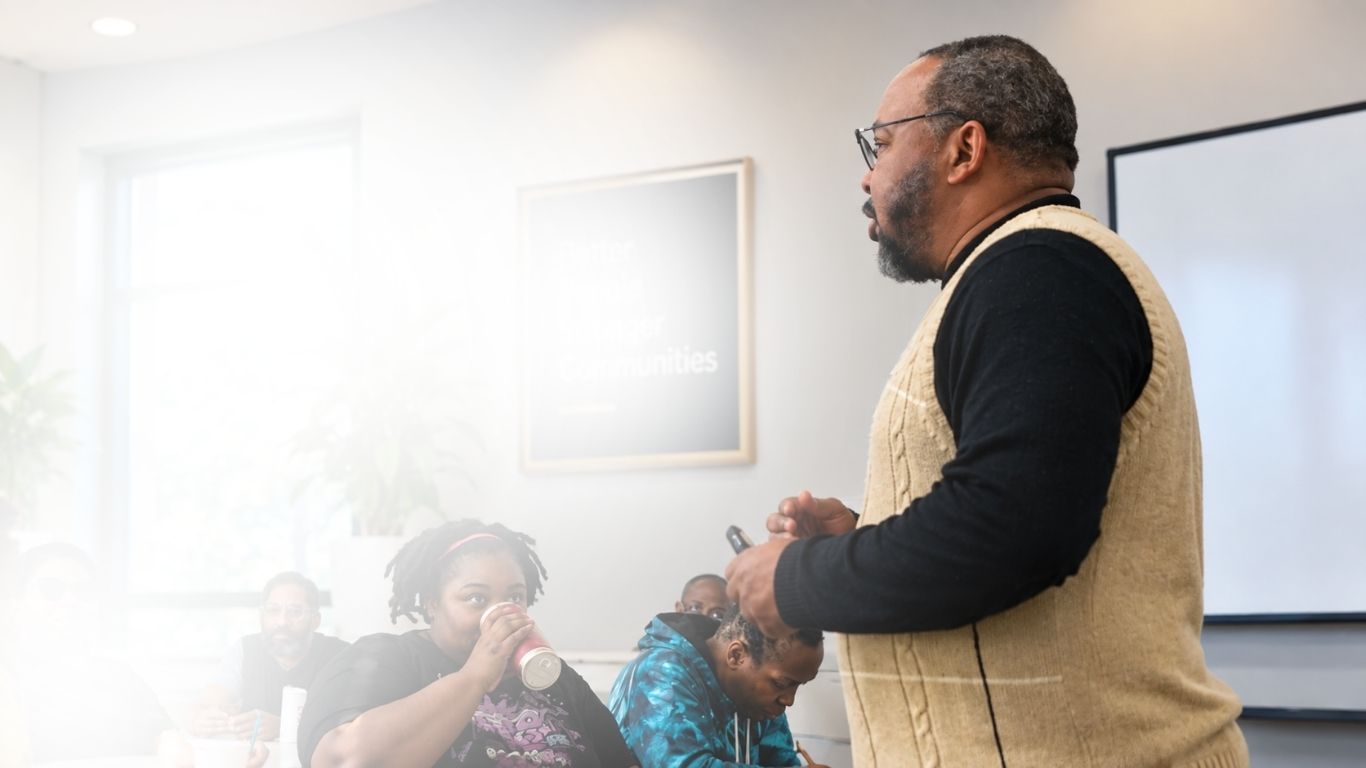 A Bible teacher leading a class of adult learners
